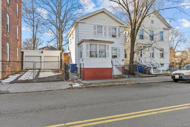 front of property with an outbuilding and a garage