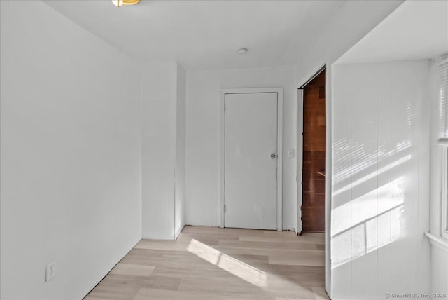 spare room with light hardwood / wood-style flooring