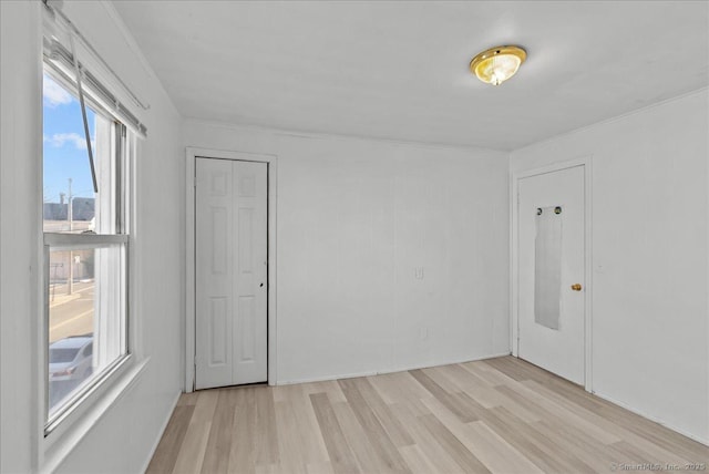 spare room featuring light wood-type flooring