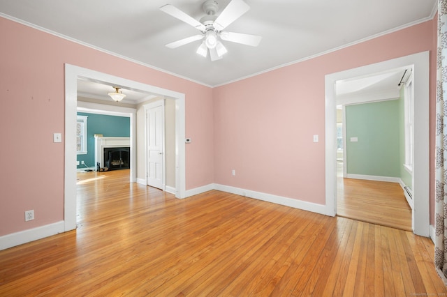 unfurnished room with baseboard heating, ceiling fan, light hardwood / wood-style flooring, and ornamental molding