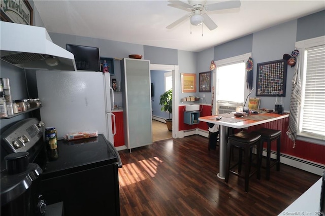 kitchen featuring ceiling fan, dark hardwood / wood-style flooring, black electric range oven, white refrigerator, and extractor fan