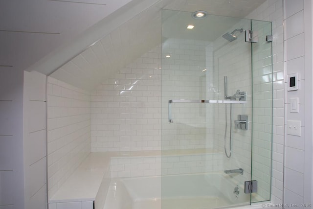 bathroom with shower / bath combination with glass door and vaulted ceiling