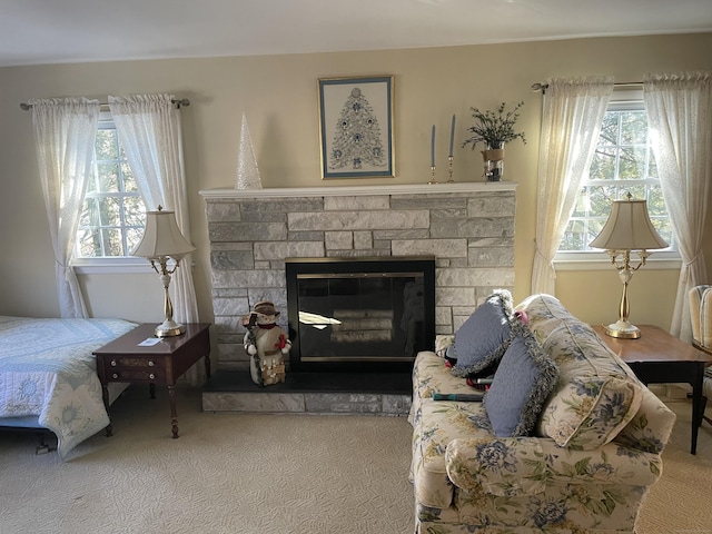 living room with a fireplace and carpet floors