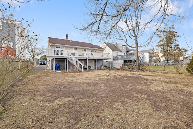 back of property featuring a deck