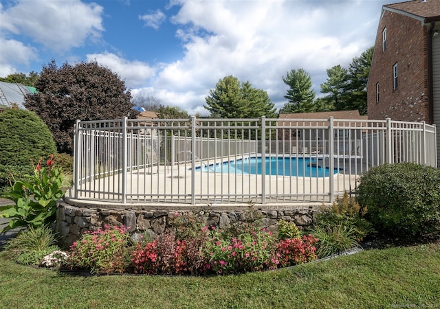 view of swimming pool featuring a patio area