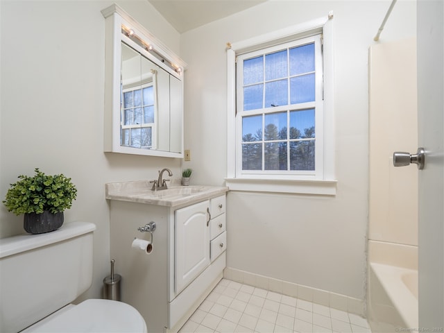 bathroom with tile patterned floors, vanity, and toilet