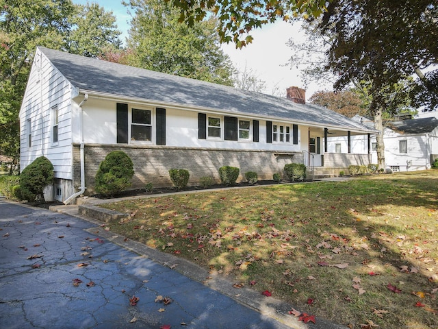 view of front of home with a front lawn and a porch