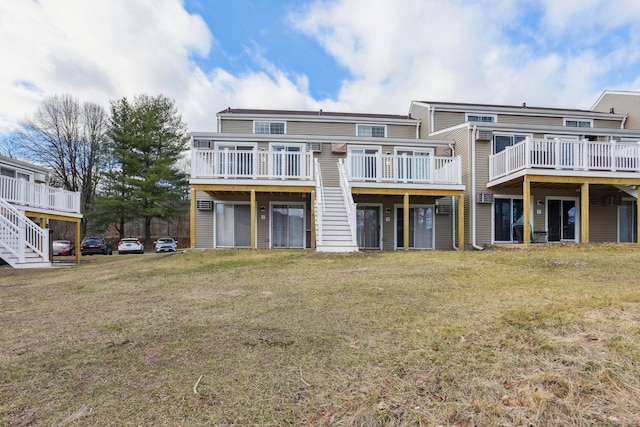 rear view of house with a lawn