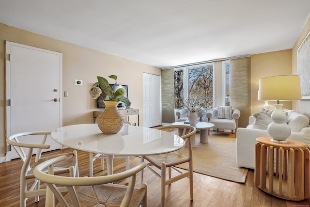 dining area featuring hardwood / wood-style flooring and floor to ceiling windows