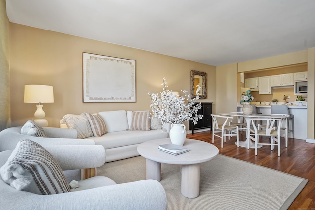 living room with dark hardwood / wood-style flooring