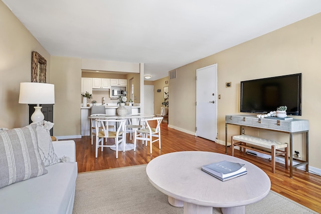 living room with light hardwood / wood-style floors