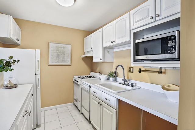 kitchen with white cabinetry, white appliances, sink, and custom range hood