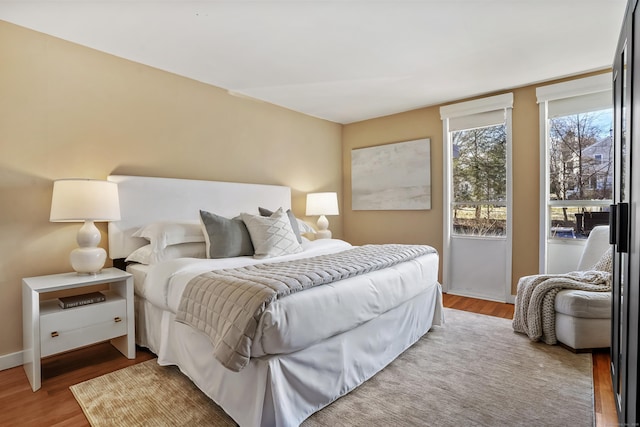 bedroom with hardwood / wood-style flooring