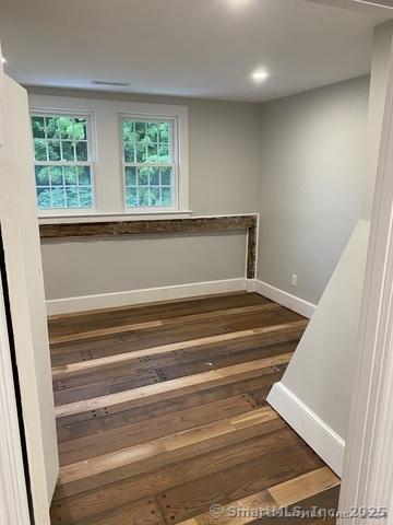 stairs with hardwood / wood-style flooring