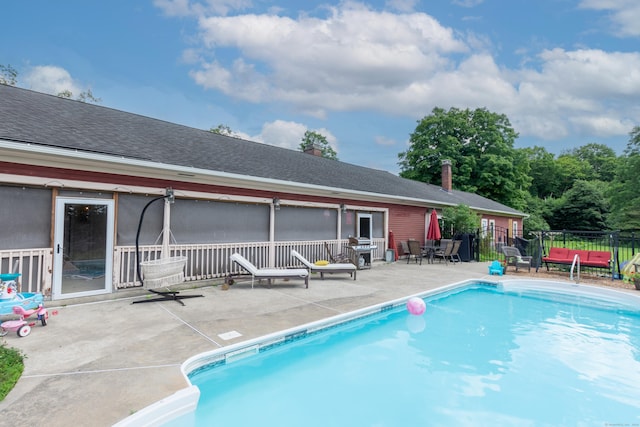 view of pool featuring a patio