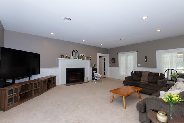 living room featuring light carpet