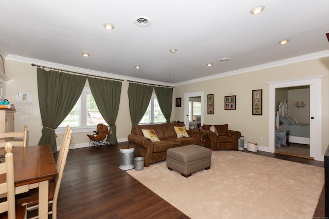 living room with wood-type flooring and ornamental molding