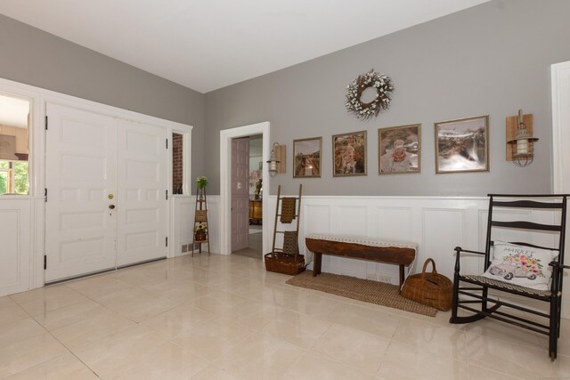 entryway featuring light tile patterned floors