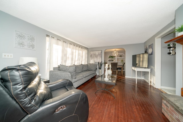 living room with dark hardwood / wood-style floors