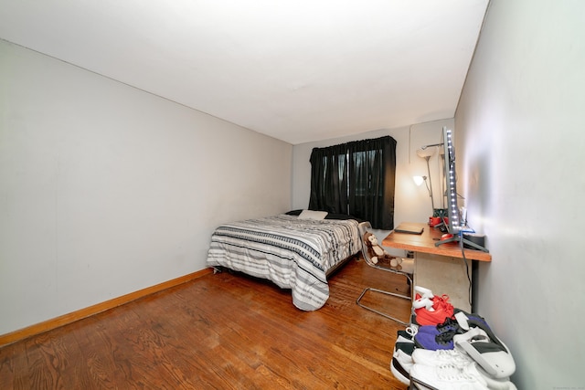 bedroom featuring hardwood / wood-style flooring