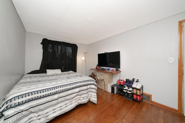 bedroom with wood-type flooring