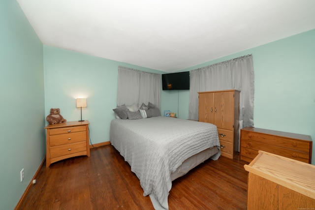 bedroom featuring dark wood-type flooring