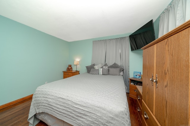 bedroom featuring dark hardwood / wood-style flooring