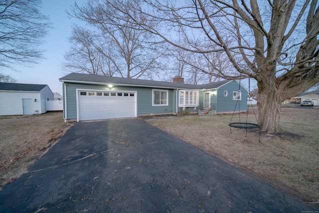 single story home featuring a garage