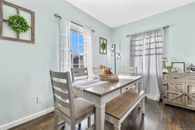 dining room with dark hardwood / wood-style flooring