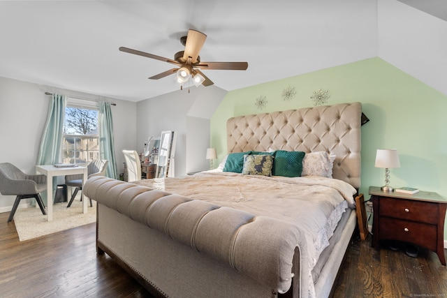 bedroom with dark hardwood / wood-style flooring, ceiling fan, and lofted ceiling