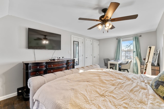 bedroom with ceiling fan and dark wood-type flooring