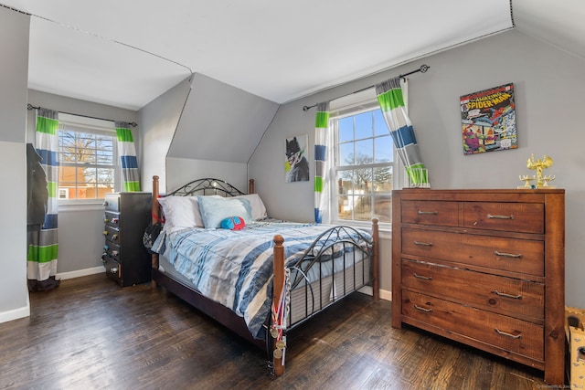 bedroom featuring dark hardwood / wood-style flooring and lofted ceiling