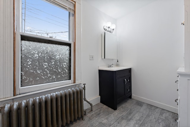 bathroom featuring vanity and radiator