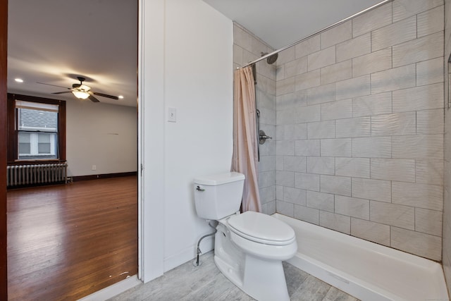 bathroom featuring a shower with curtain, ceiling fan, toilet, and radiator heating unit