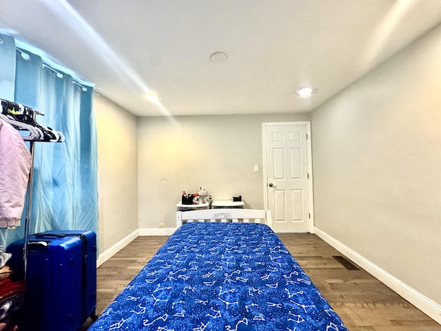 bedroom featuring dark wood-type flooring