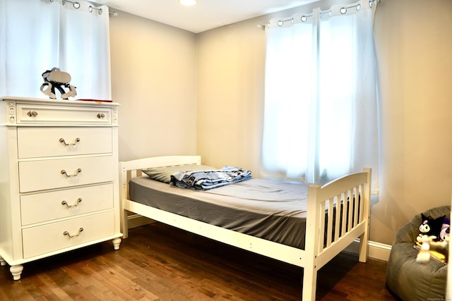 bedroom featuring dark wood-type flooring