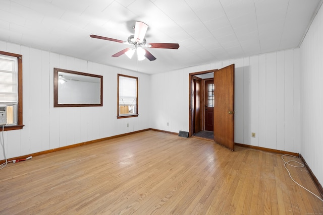 unfurnished room with ceiling fan and light wood-type flooring