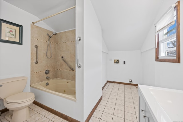 full bathroom featuring tile patterned floors, vanity, lofted ceiling, and tiled shower / bath