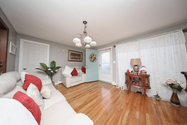 living room with a chandelier and hardwood / wood-style floors