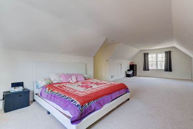 bedroom with carpet and vaulted ceiling