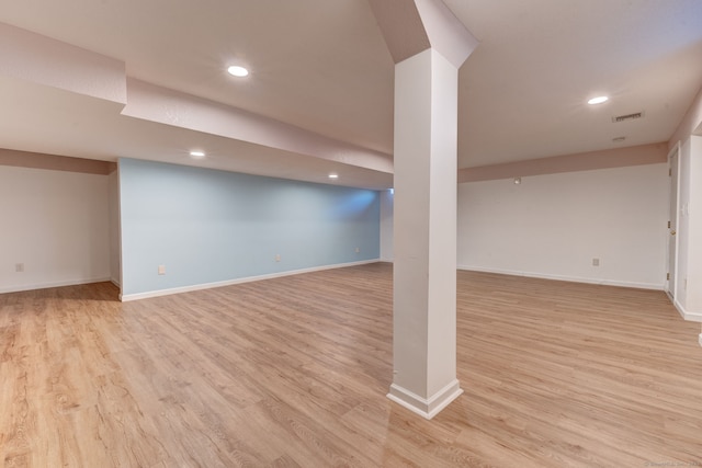 basement featuring light wood-type flooring