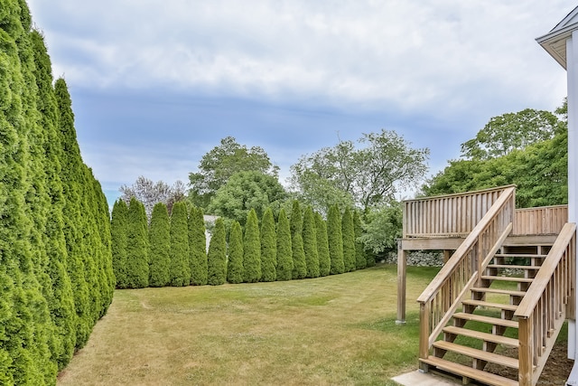 view of yard with a wooden deck