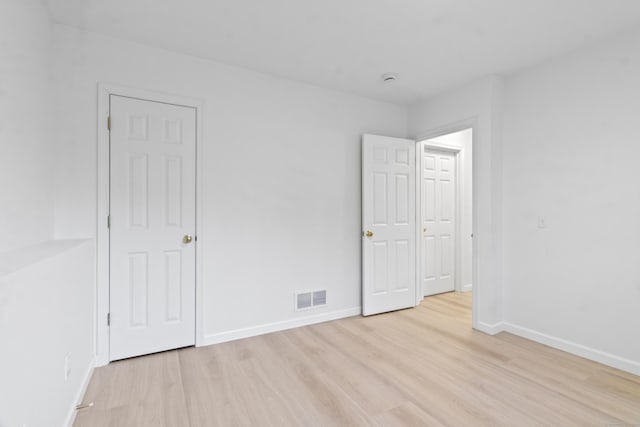 spare room featuring light hardwood / wood-style floors