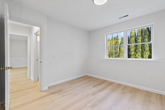 empty room with light wood-type flooring