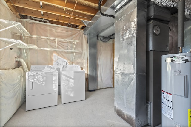 basement featuring water heater and washer and dryer