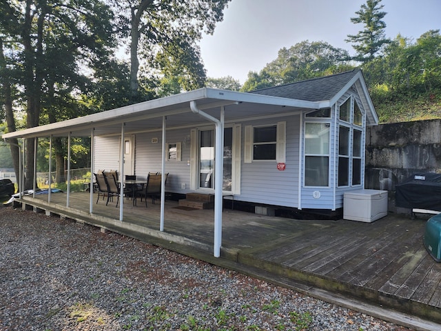 rear view of house with a deck