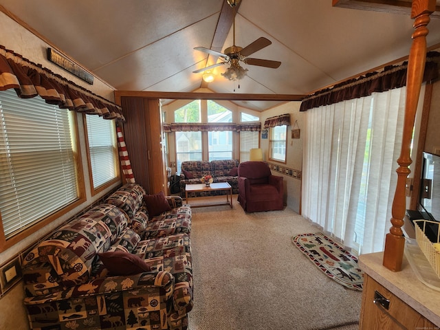 living room featuring carpet flooring, ceiling fan, and lofted ceiling