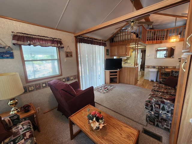 living room with ceiling fan and lofted ceiling