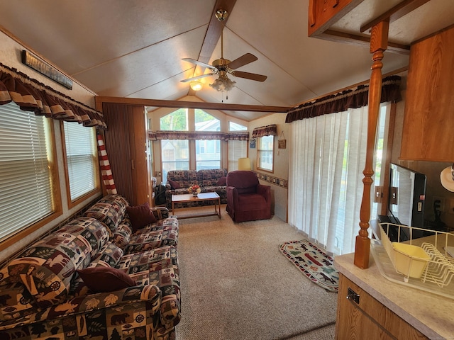 living room with carpet, vaulted ceiling, and ceiling fan