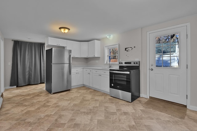 kitchen featuring white cabinets, sink, and stainless steel appliances